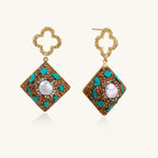 Gold quatrefoil stud earrings with ornate square pendants featuring turquoise stones and freshwater pearls